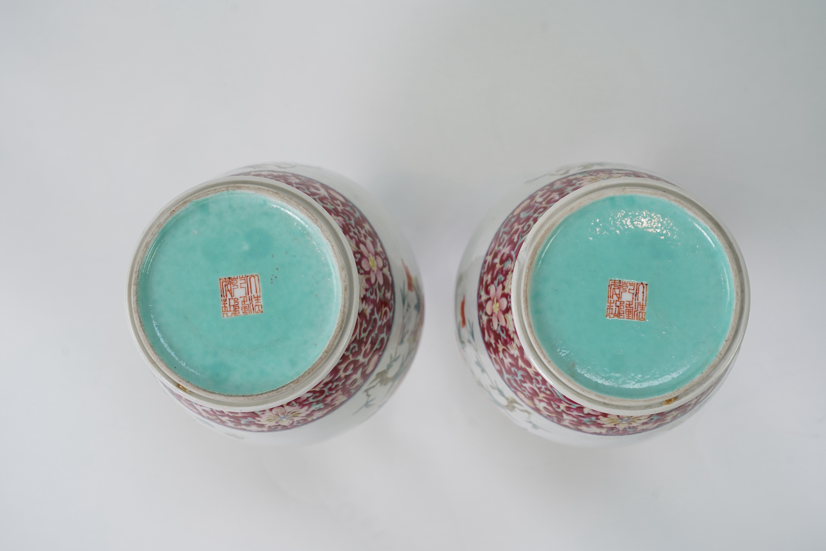 A pair of Chinese famille rose ‘sanduo’ vases, Qianlong seal mark, 19th century